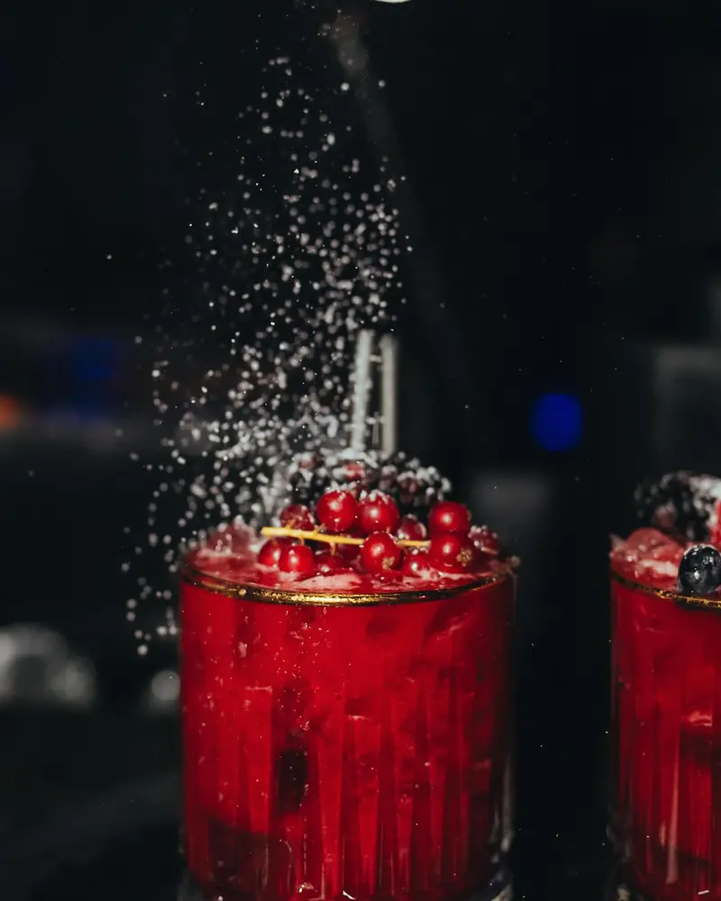 Red berry cocktails under a dusting of sugar on a Saturday at Mayfair