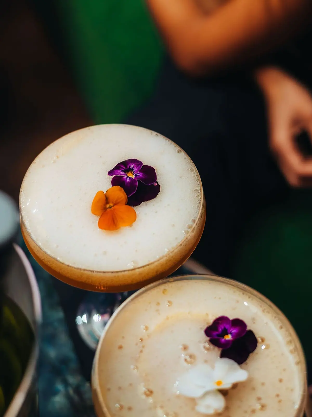 Two sours finished with edible flowers