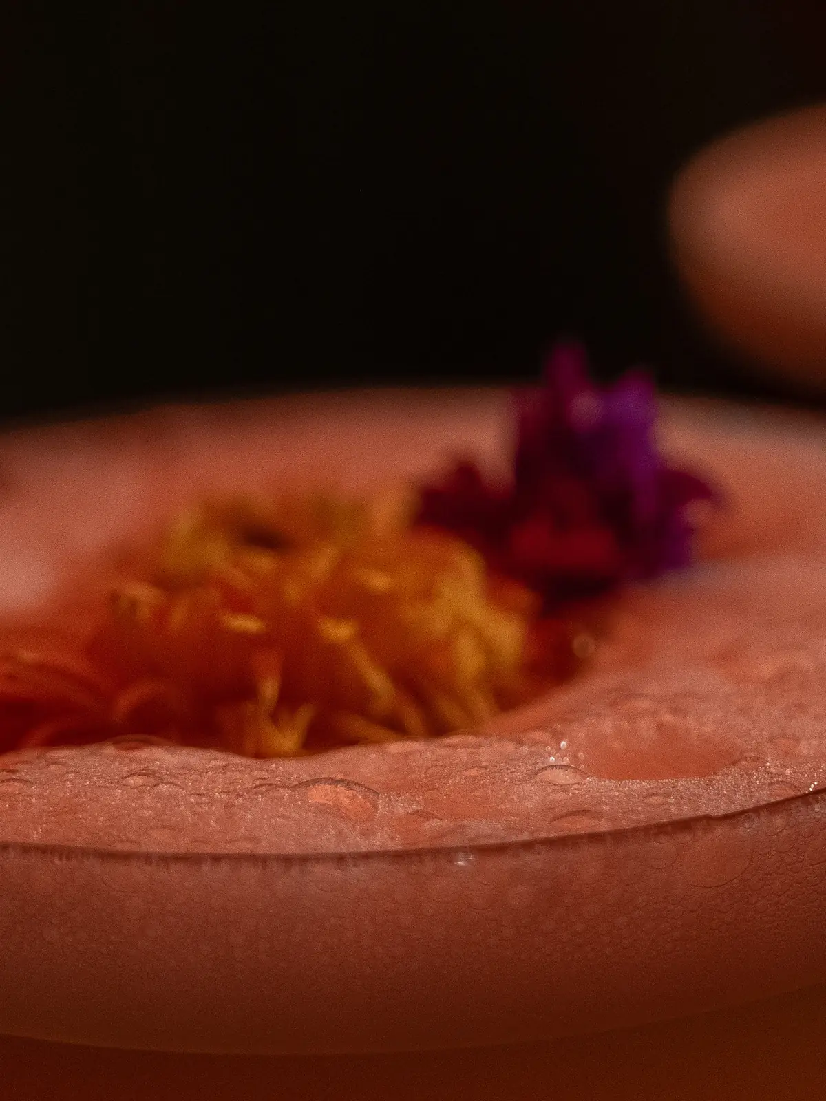 A sour with dried flowers on the foam, at the bar of Mayfair